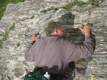 Rex and Pete scale a more difficult wall