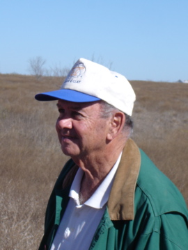 Don smiling after Ward finds the beer