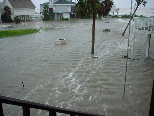 Wind streaks visible across floodwater