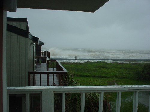 Surf breaking over the Pirates Beach dune socks